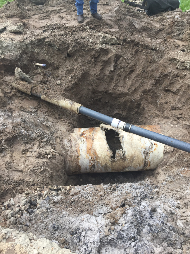 Ruptured pipe lining causing erosion of the surrounding area